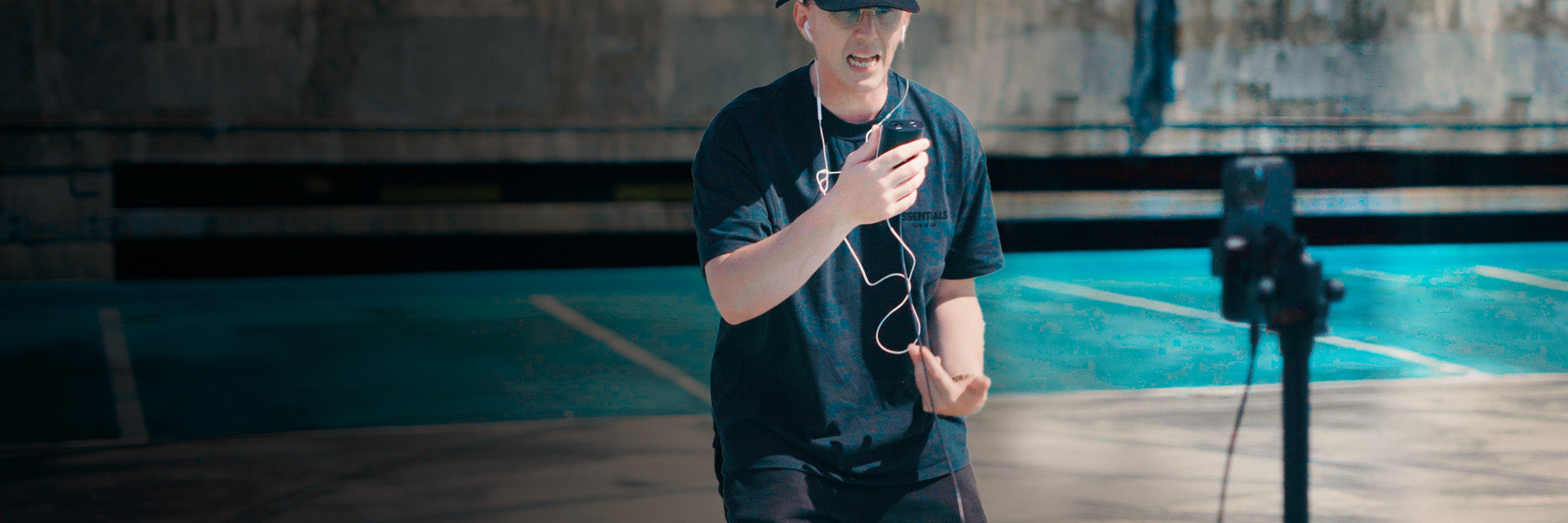 Rapper creating music and recording himself performing outdoors with the Blackstar Polar Go pocket studio for creators.